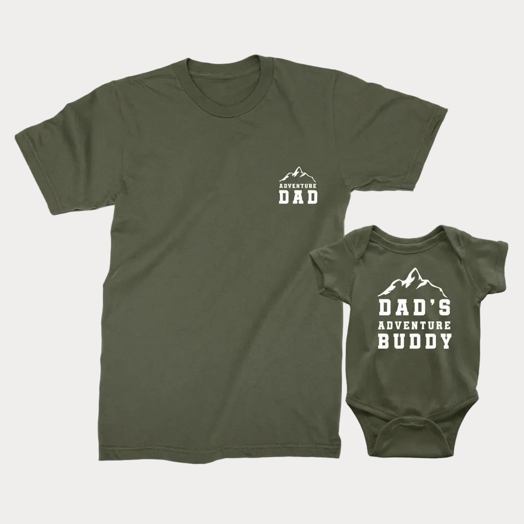 A military green t-shirt for adults and a military green bodysuit for babies with text 'ADVENTURE DAD' and 'DAD'S ADVENTURE BUDDY' printed on them.