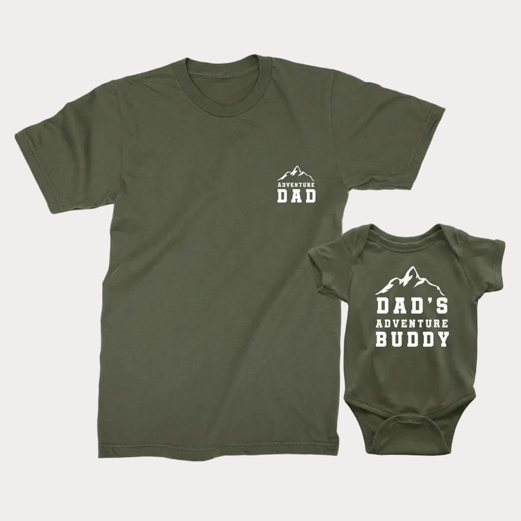 A military green t-shirt for adults and a military green bodysuit for babies with text 'ADVENTURE DAD' and 'DAD'S ADVENTURE BUDDY' printed on them.
