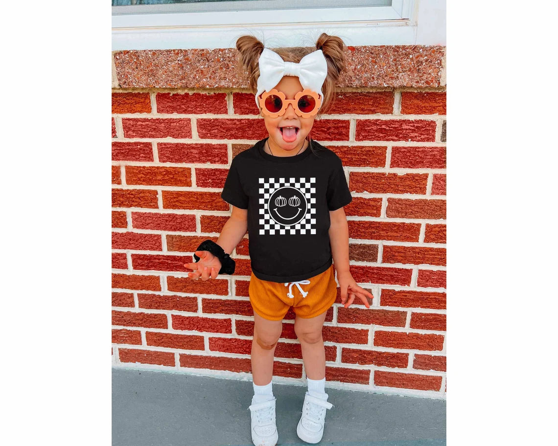 Pumpkin Checkered Smiley Face T-shirt | Halloween T-shirt for Kids | Halloween Toddler Tee | Pumpkin Baby Shirt | Fall Retro Checkered baby t-shirt