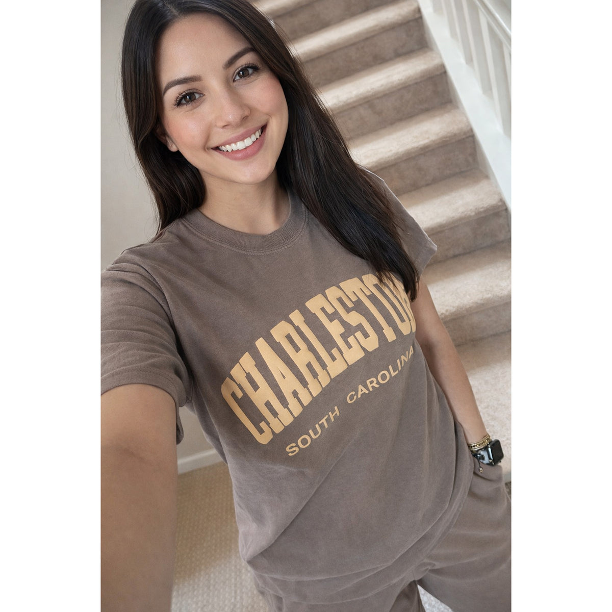 Model wearing Charleston South Carolina puff print outfit set showing large front graphic on espresso Comfort Colors® t-shirt