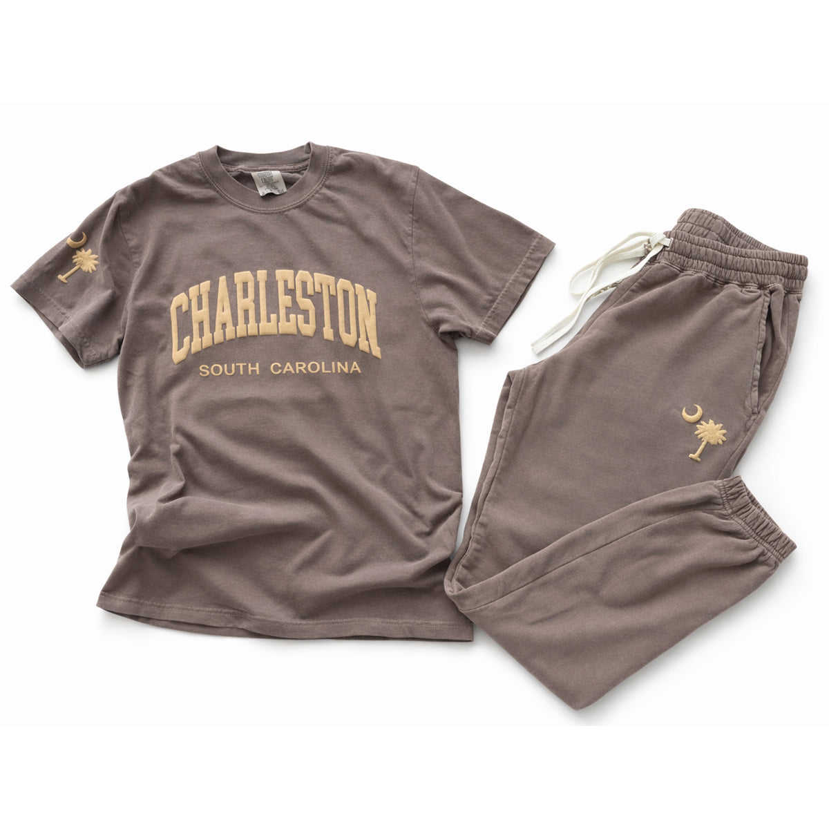 Flat lay of Charleston South Carolina matching t-shirt and sweatpants set displaying front print and palm moon sleeve and pants details