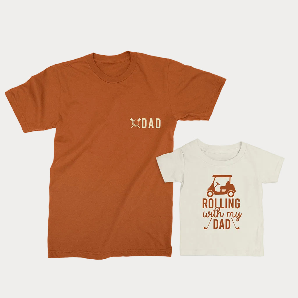 Dad and child wearing matching golf T-shirts in autumn and natural colors with Dad and Rolling With My Dad designs