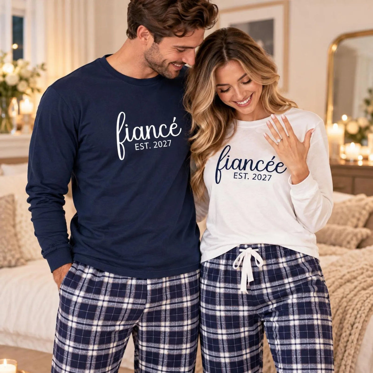 Engaged couple wearing matching fiancé and fiancée long sleeve jersey tees and plaid flannel pajama pants for engagement celebrations.