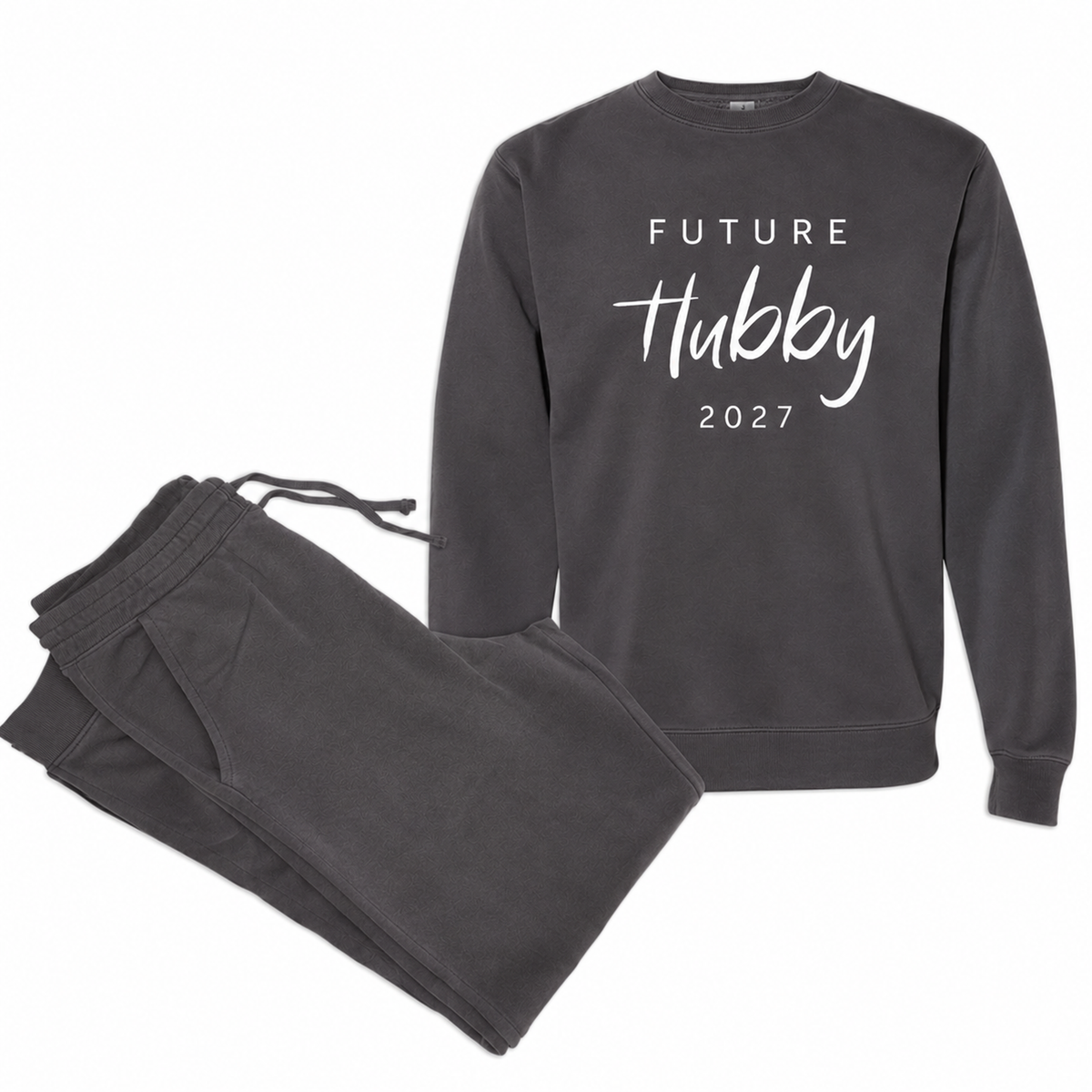 Pigment black Future Hubby sweatshirt and matching jogger sweatpants featuring white script lettering and the year 2027, arranged in a clean studio product photo.