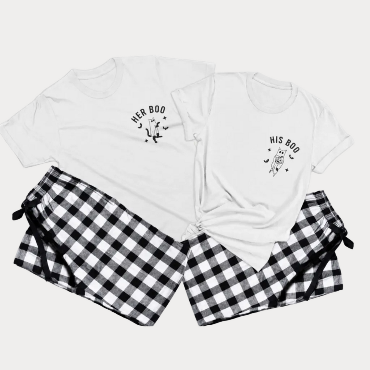 Her Boo and His Boo matching Halloween pajama sets with white t-shirts featuring cat ghost designs and black-and-white checkered flannel pants on a light gray studio background