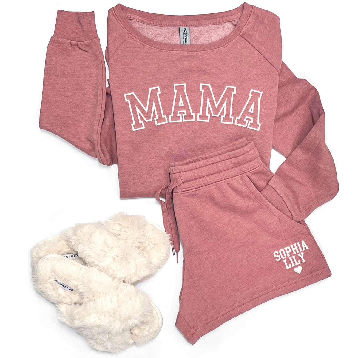 Flat lay of rose Mama sweatshirt and matching personalized sweatshorts with custom name print and heart detail.