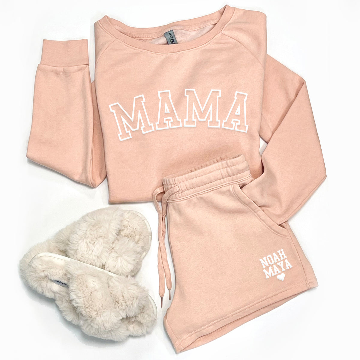 Blush Mama sweatshirt and personalized women’s sweatshorts with custom name print displayed in flat lay styling.
