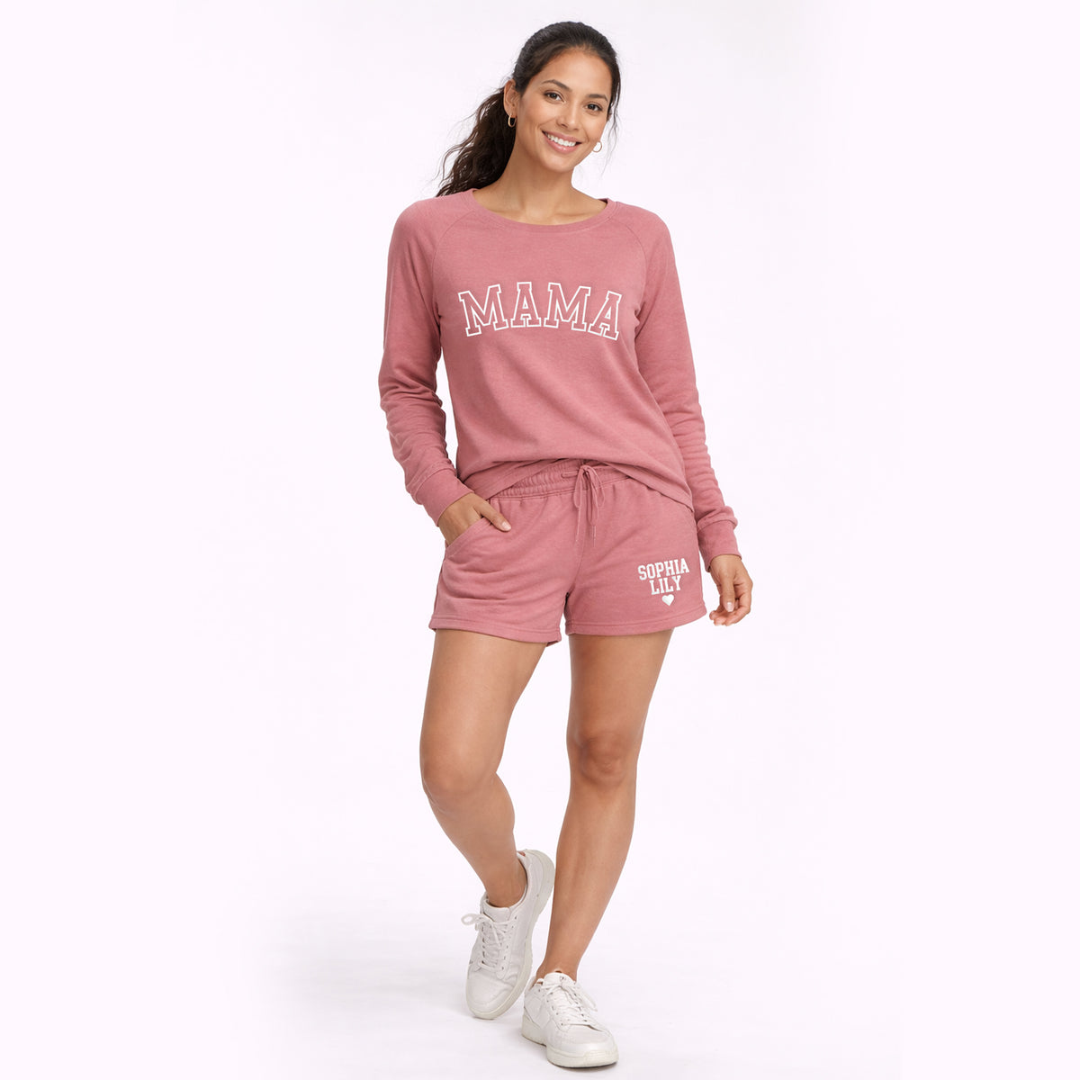 Woman modeling rose pink Mama sweatshirt and matching personalized sweatshorts, comfortable women’s lounge outfit.
