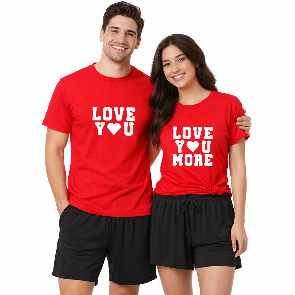 Matching couples pajama set with man and woman wearing red “Love You” and “Love You More” t-shirts and black boxer shorts on a white background