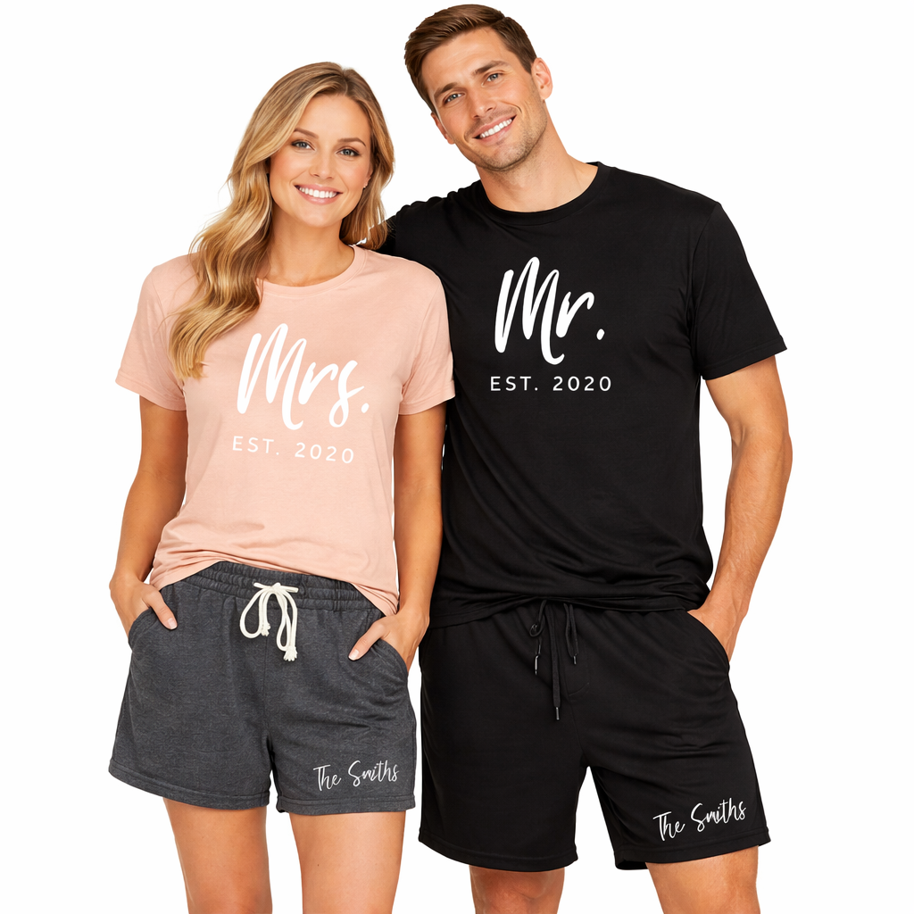 Models with a personalized Mr. and Mrs matching casual set with peach women’s t-shirt and black men’s shorts, with a custom family name detail