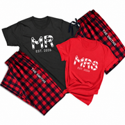 Matching MR and MRS T-shirts with EST. 2026 prints paired with personalized buffalo plaid pajama pants featuring a custom last name.