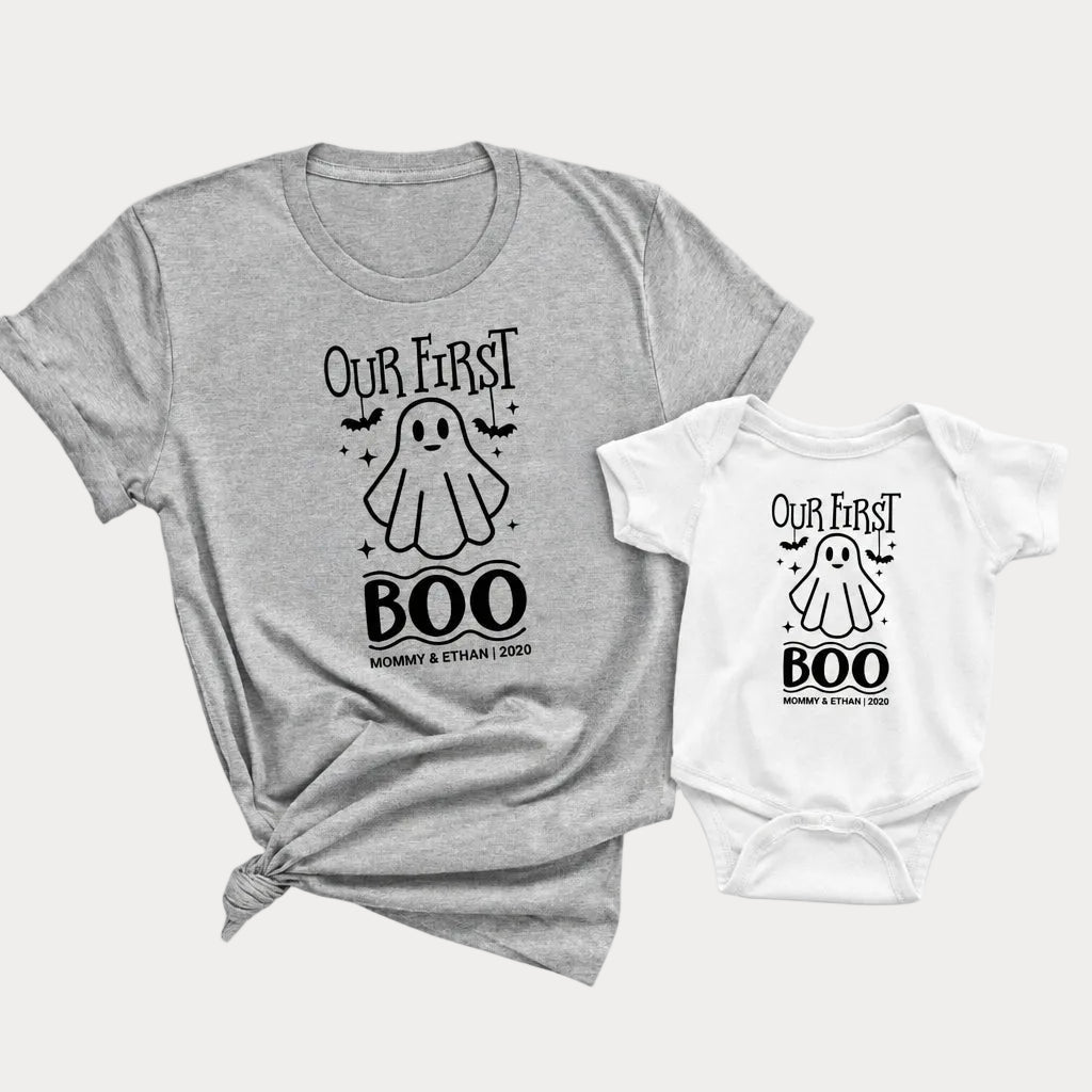 Our First Family Boo matching Halloween set with an athletic heather adult t-shirt and white baby onesie featuring a ghost design