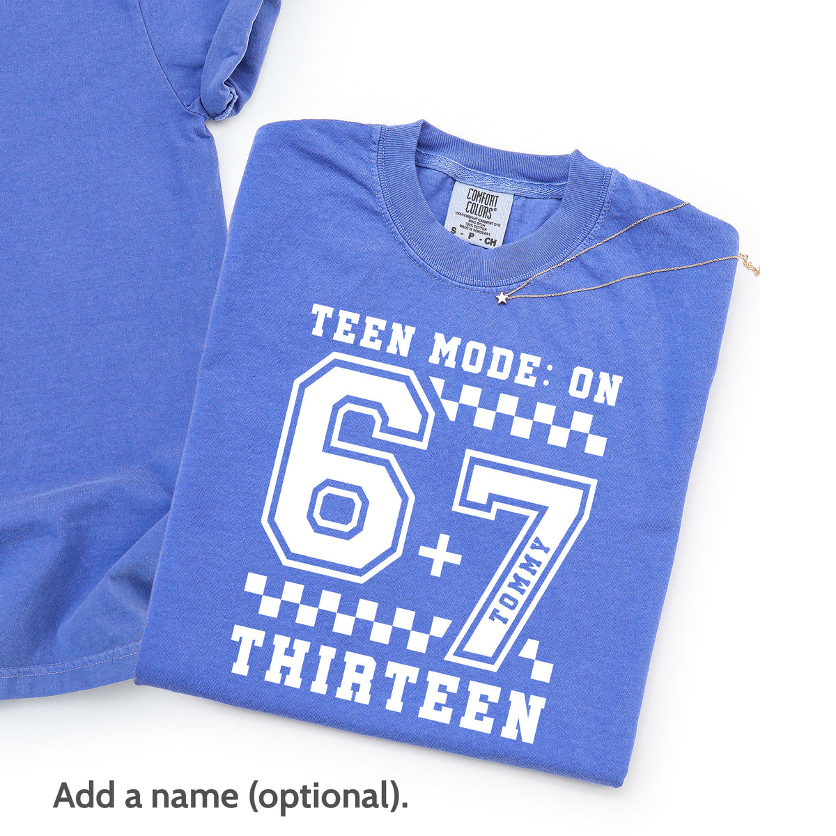 Close up of flo blue 13th birthday t-shirt front print “Teen Mode: On 6+7 Thirteen” with option to add custom name, personalized official teenager shirt