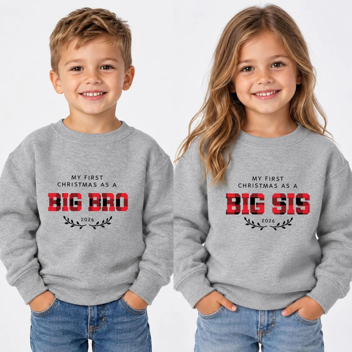 Two children wearing matching personalized My First Christmas sweatshirts featuring Big Bro and Big Sis designs with a 2026 year print and decorative branches. Matching sibling Christmas outfits for celebrating a new baby and creating family holiday memories.