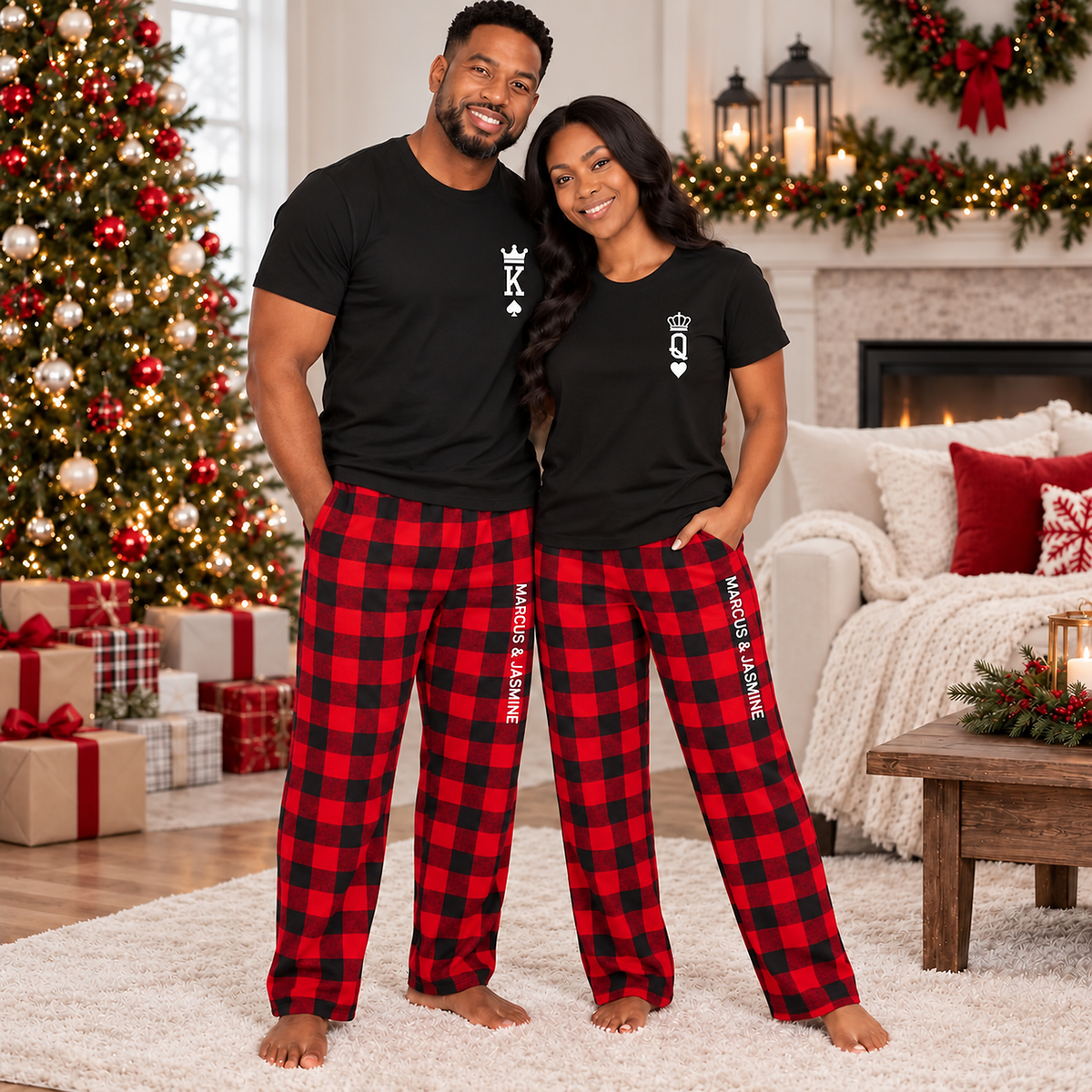 Couple wearing personalized King and Queen T-shirts with matching buffalo plaid Christmas pajama pants featuring custom names, posing together in a cozy living room decorated for Christmas.