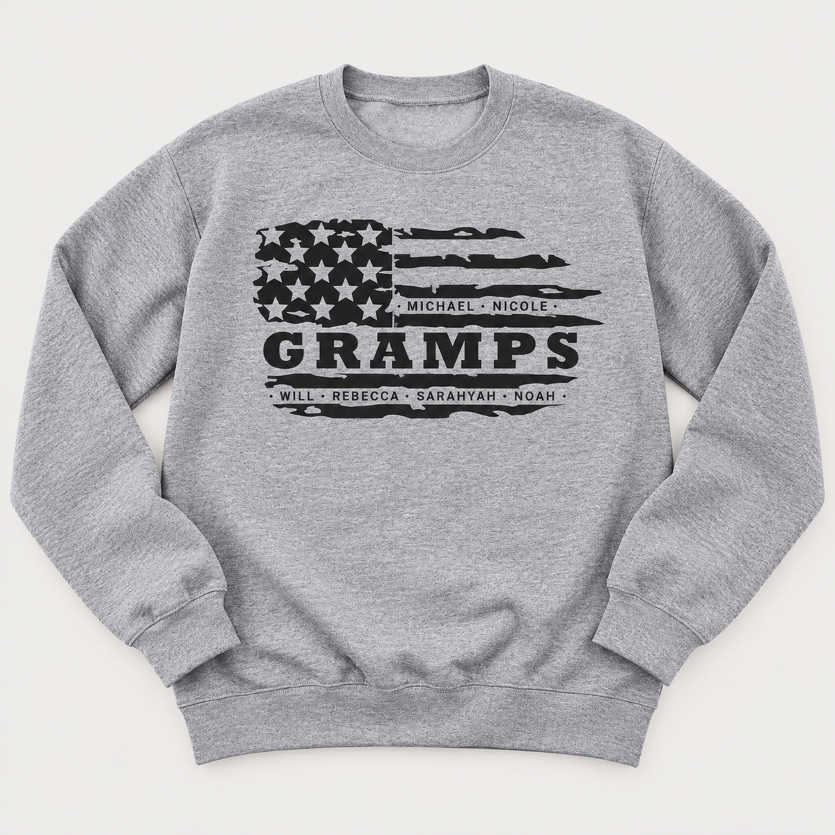 Personalized Gramps sweatshirt in Athletic Heather featuring a distressed American flag design and customized grandchildren’s names.