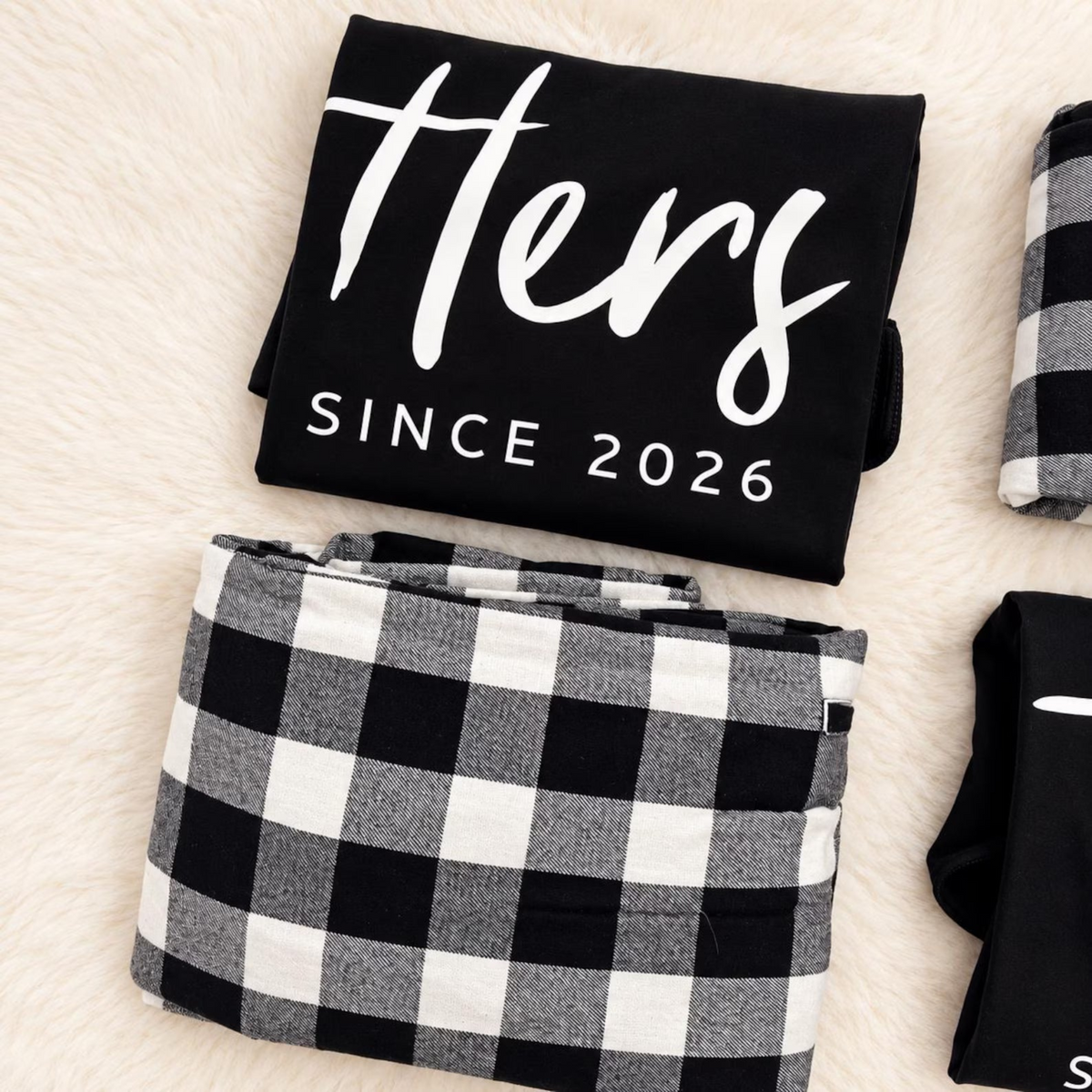 Folded personalized Hers long-sleeve pajama shirt featuring custom anniversary-year text, paired with matching buffalo plaid flannel pajama pants.