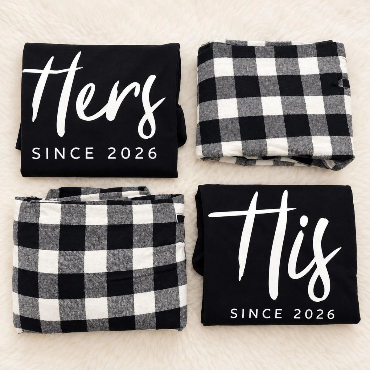 Personalized His and Hers matching pajamas featuring folded long-sleeve shirts with custom anniversary-year prints and coordinating buffalo plaid flannel pajama pants.
