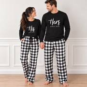 Couple wearing personalized His and Hers matching pajamas with long-sleeve shirts featuring a custom anniversary year and buffalo plaid flannel pajama pants personalized with their names.