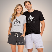 Models with Personalized summer matching set for couples with black Mr. T-shirt, athletic heather Mrs. T-shirt, and custom family name shorts on white background