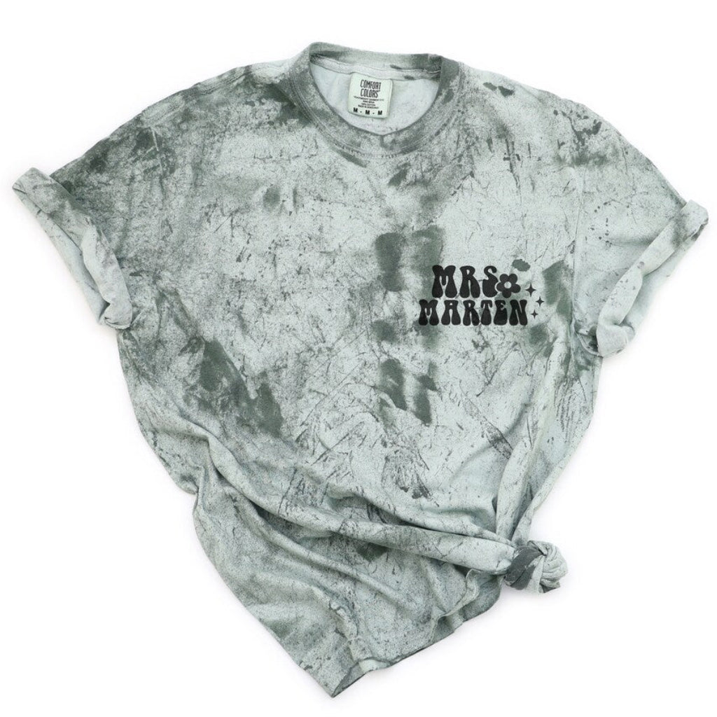 Garment-dyed T-shirt featuring a personalized Mrs. and custom name print on the front chest, styled with rolled sleeves and a knotted hem.