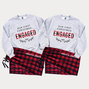 Matching Our First Christmas Engaged 2026 couple sweatshirts paired with personalized flannel pajama pants featuring custom names, displayed as a coordinated Christmas engagement sleepwear set.