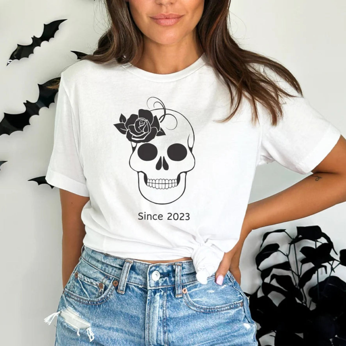 White skull Halloween t-shirt with black rose, skeleton design, and Since 2023 graphic