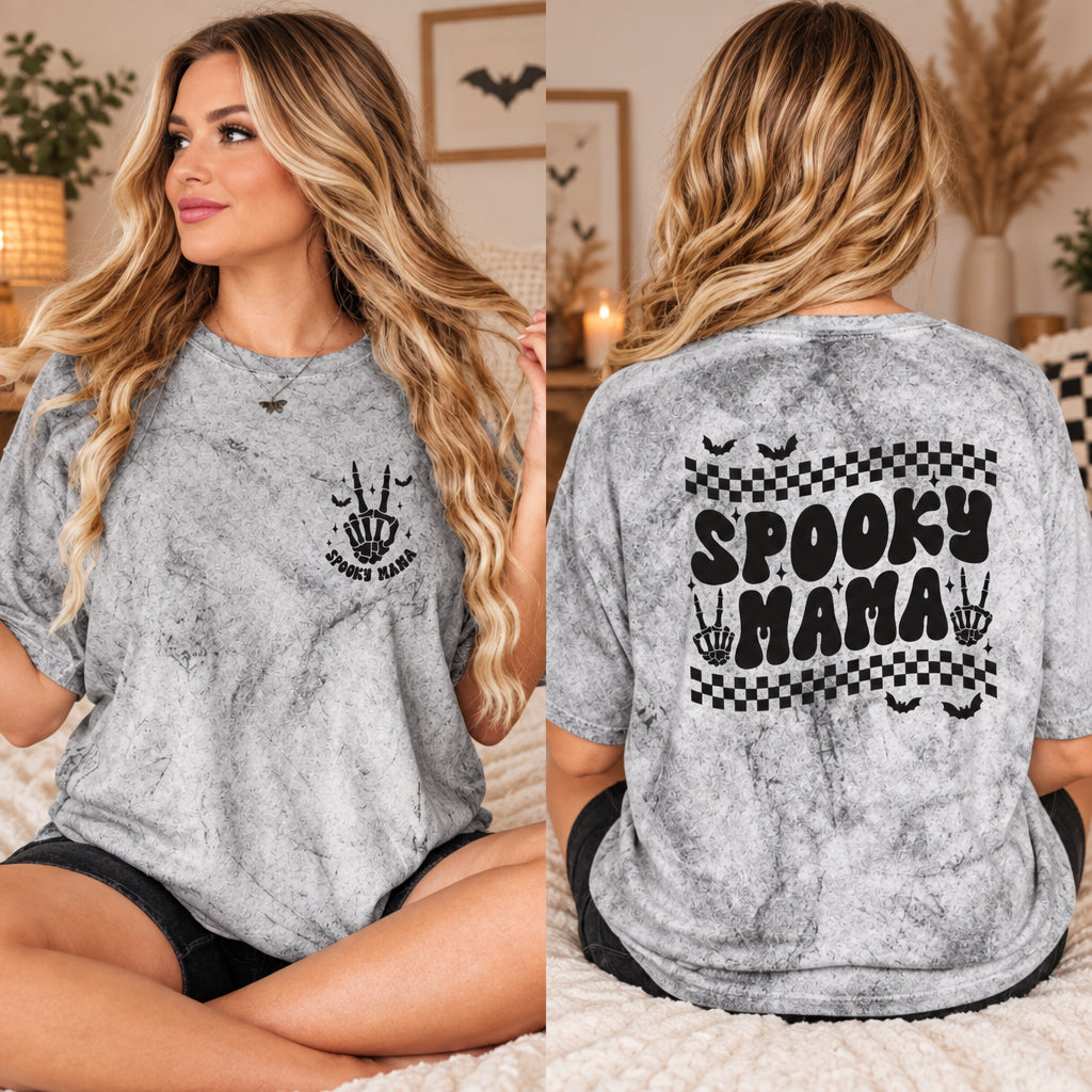 Spooky Mama Halloween shirt with front and back graphics, bats, skeleton hands, and checkerboard details on a garment-dyed t-shirt