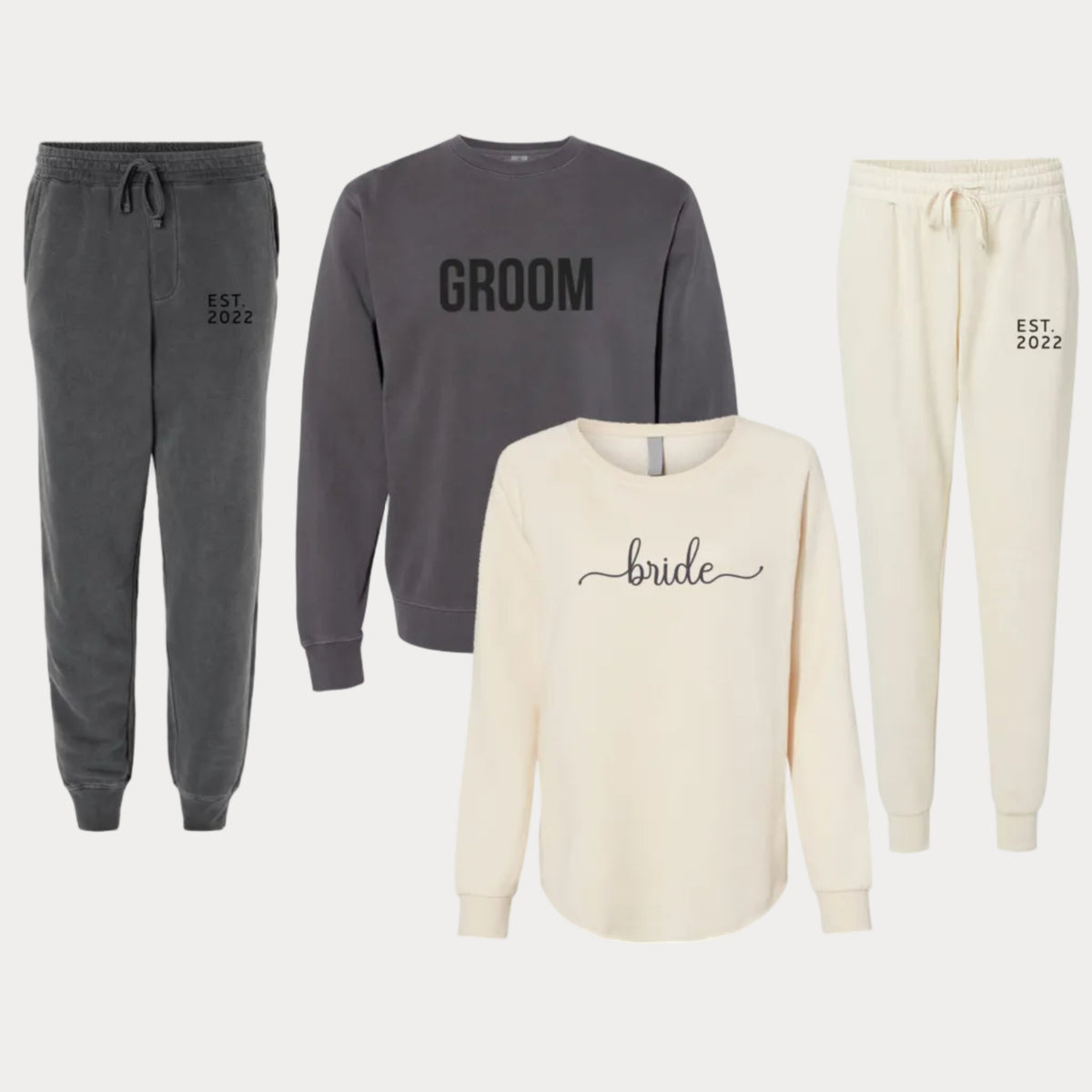 Bride and groom matching sweatshirts and joggers featuring bridal lettering and personalized EST. 2022 wedding date details