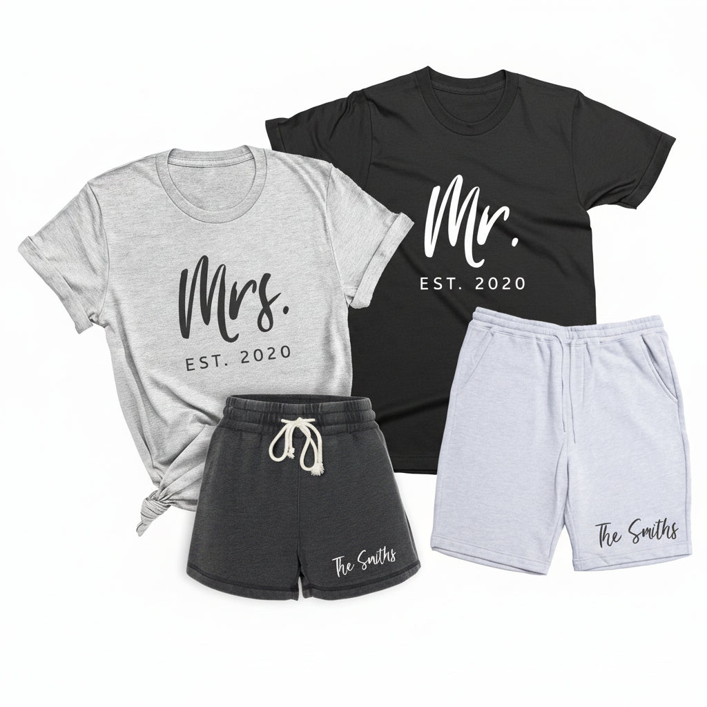 Personalized summer matching set for couples with black Mr t shirt, athletic heather Mrs t shirt and custom family name shorts on white background